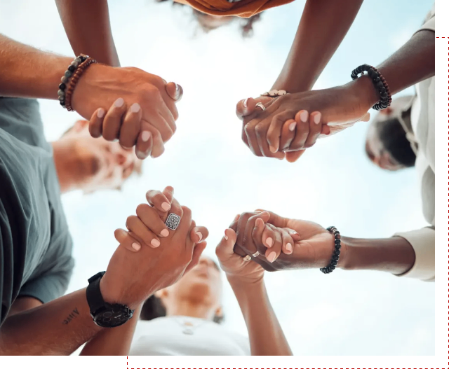 Diverse group holding hands in unity.